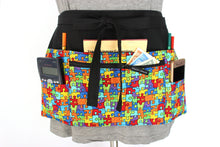 Load image into Gallery viewer, Autism awareness puzzle six pocket teacher apron with zipper pocket - Tracey Lipman