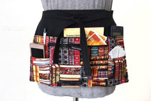 Load image into Gallery viewer, pocket apron gift for book lover - teacher appreciation gift - book print fabric half apron - black utility apron zipper pocket waist apron