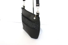Load image into Gallery viewer, Black vegan leather crossbody bag with lots of pockets for everyday carry essentials, medium sized, zipper closure, adjustable strap