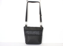 Load image into Gallery viewer, Black vegan leather crossbody bag with lots of pockets for everyday carry essentials, medium sized, zipper closure, adjustable strap