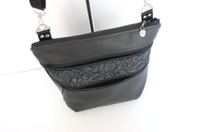 Load image into Gallery viewer, Black vegan leather crossbody bag with lots of pockets for everyday carry essentials, medium sized, zipper closure, adjustable strap