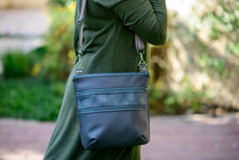 Load image into Gallery viewer, Black vegan leather crossbody bag with lots of pockets for everyday carry essentials, medium sized, zipper closure, adjustable strap