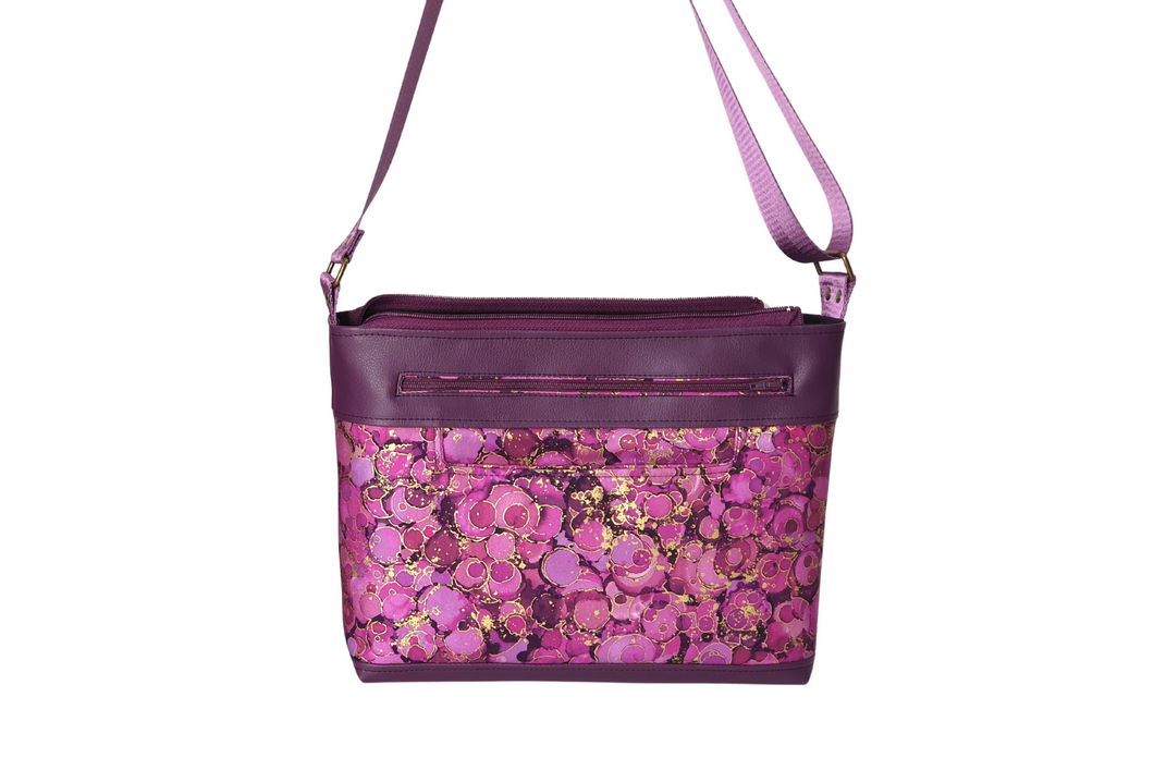 Multi pocket, medium sized, fabric and vegan leather cross body purse