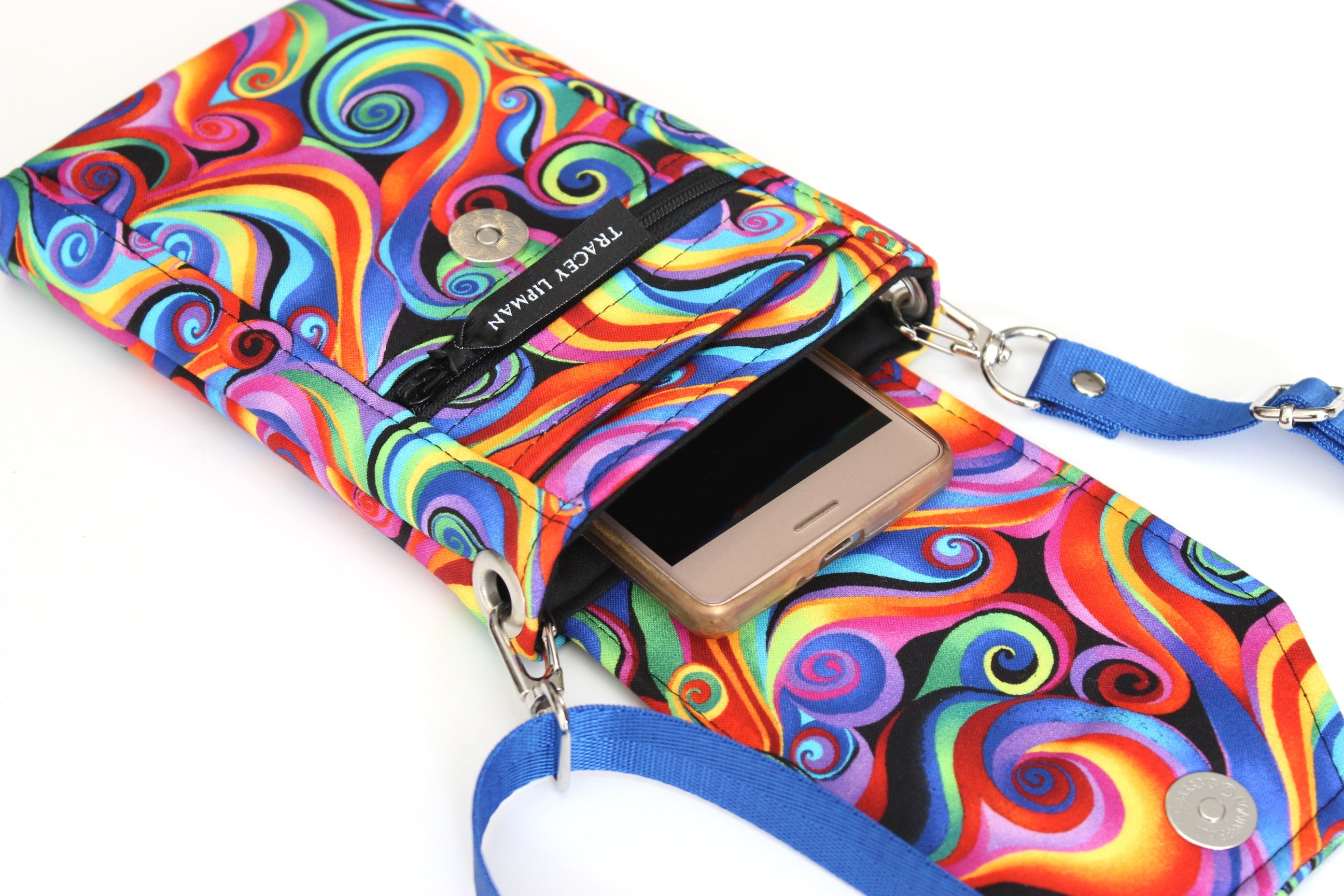 Minimalist crossbody cell phone bag in colorful retro spiral fabric