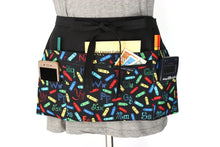 Load image into Gallery viewer, Alphabet teacher apron with pockets - half apron with zipper pocket - Tracey Lipman
