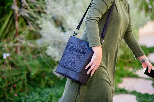 Black vegan leather bucket bag for women, faux leather cross body purse handbag lots of pockets, zipper, fabric cross over bag crossbody